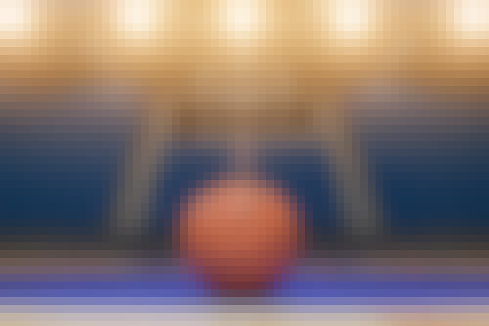 Basketball sitting on the court.