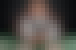 Dealer holding out deck to player.