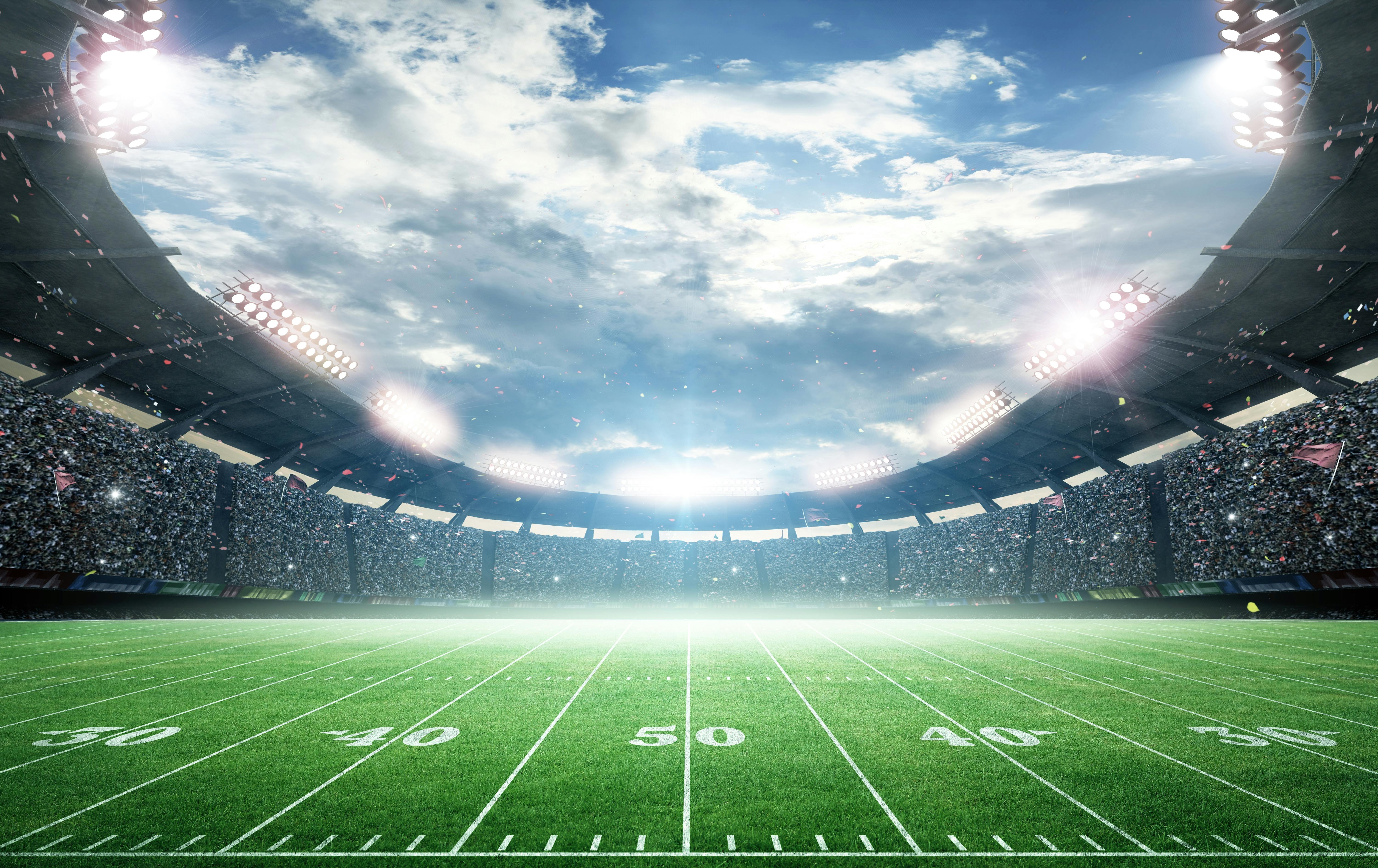 Wide angle view of a football field centered on the 50 yard line.