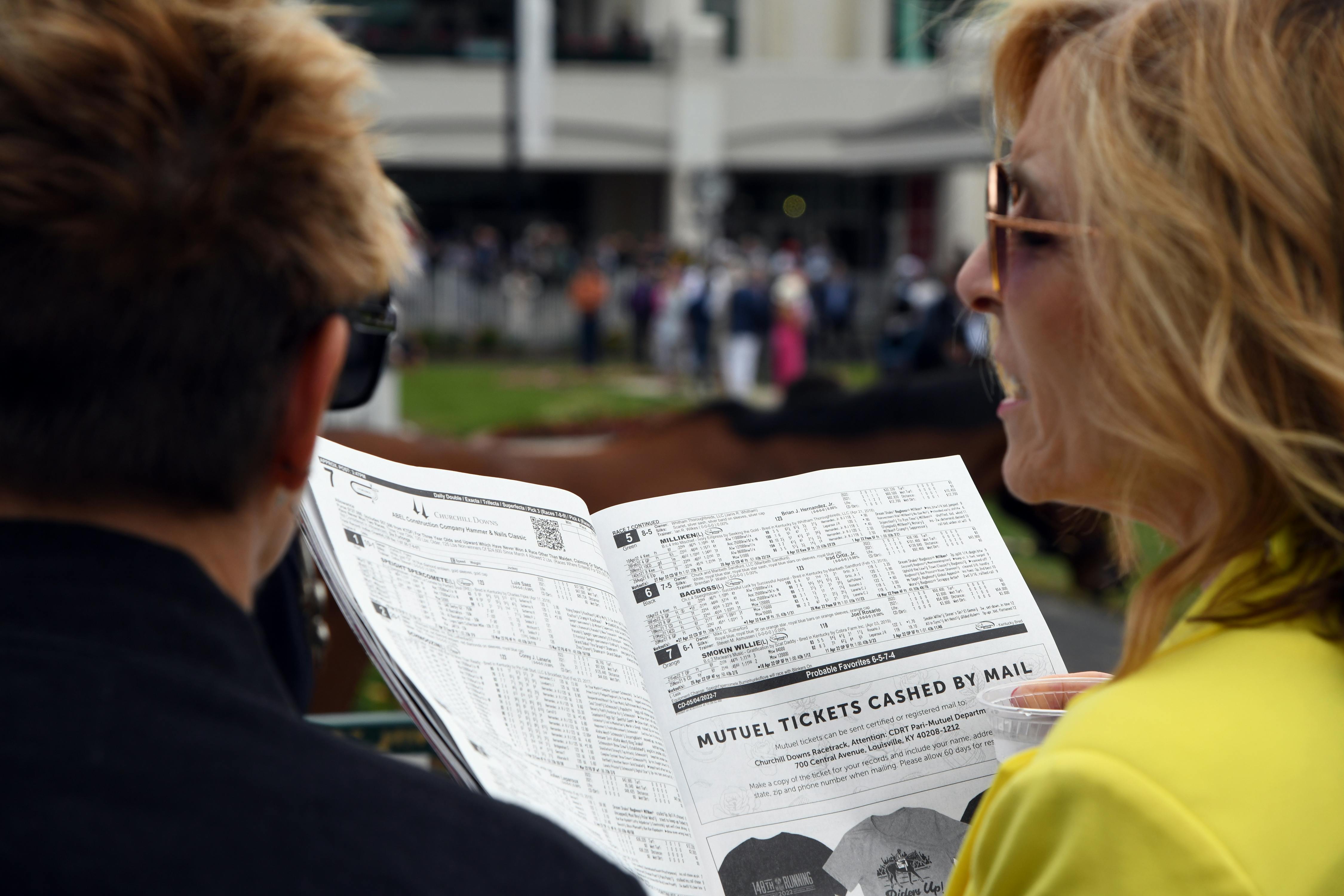 Handicapping horse racing with a race program at Churchill Downs