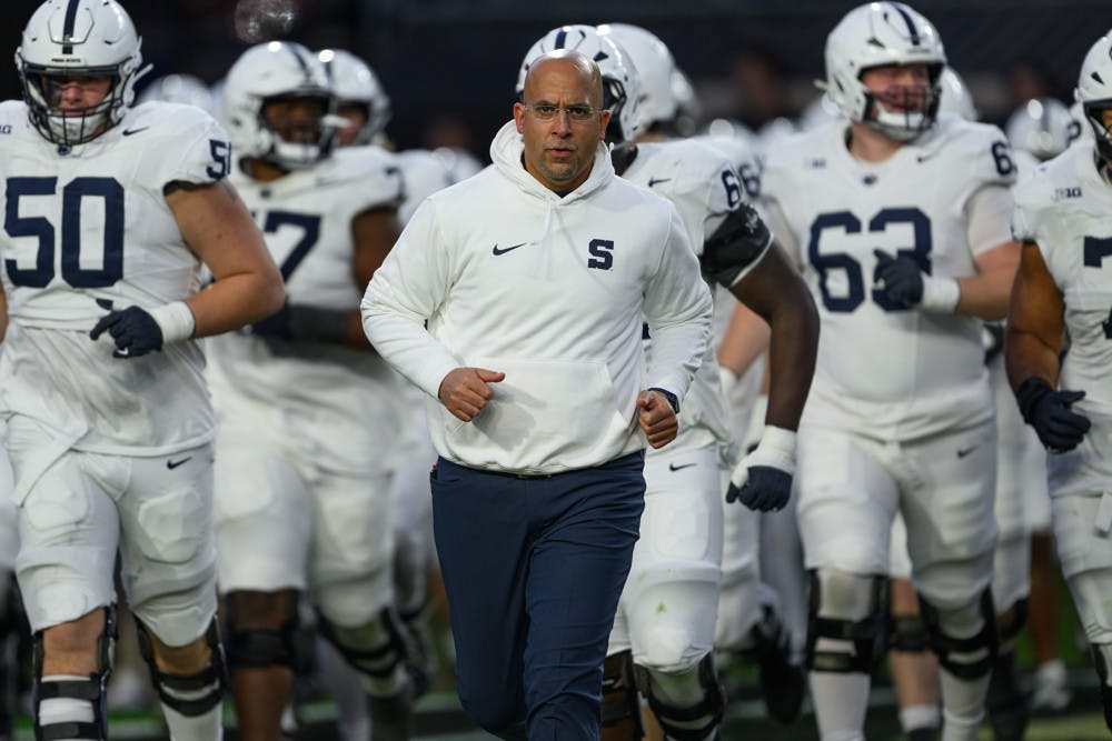 WEST LAFAYETTE, IN - NOVEMBER 16: Penn State Nittany Lions head coach James Franklin runs out on the field with his players during the college football game between the Purdue Boilermakers and Penn State Nittany Lions on November 16, 2024, at Ross-Ade Stadium in West Lafayette, IN