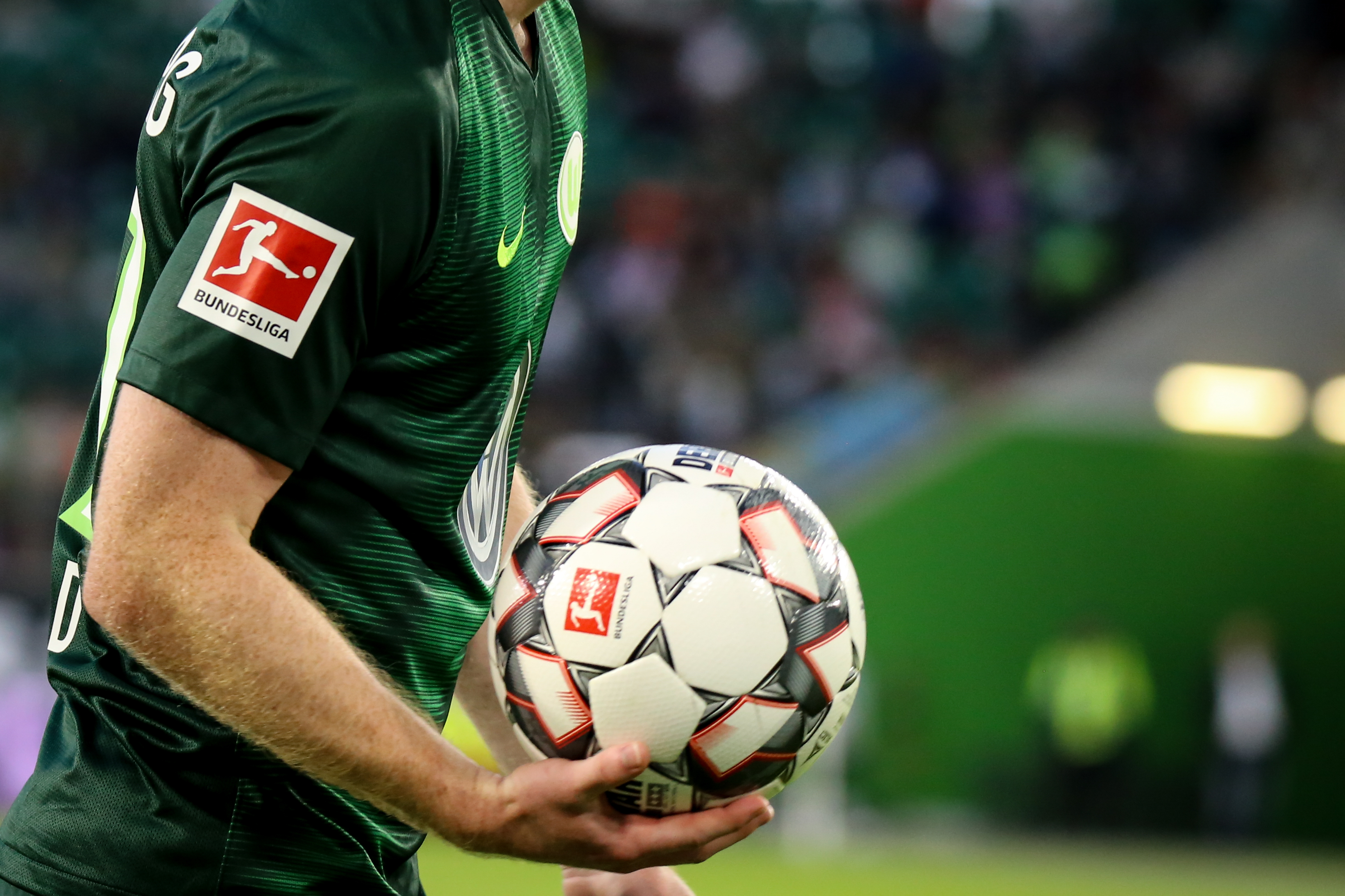 Soccer player take the official bundesliga ball. 