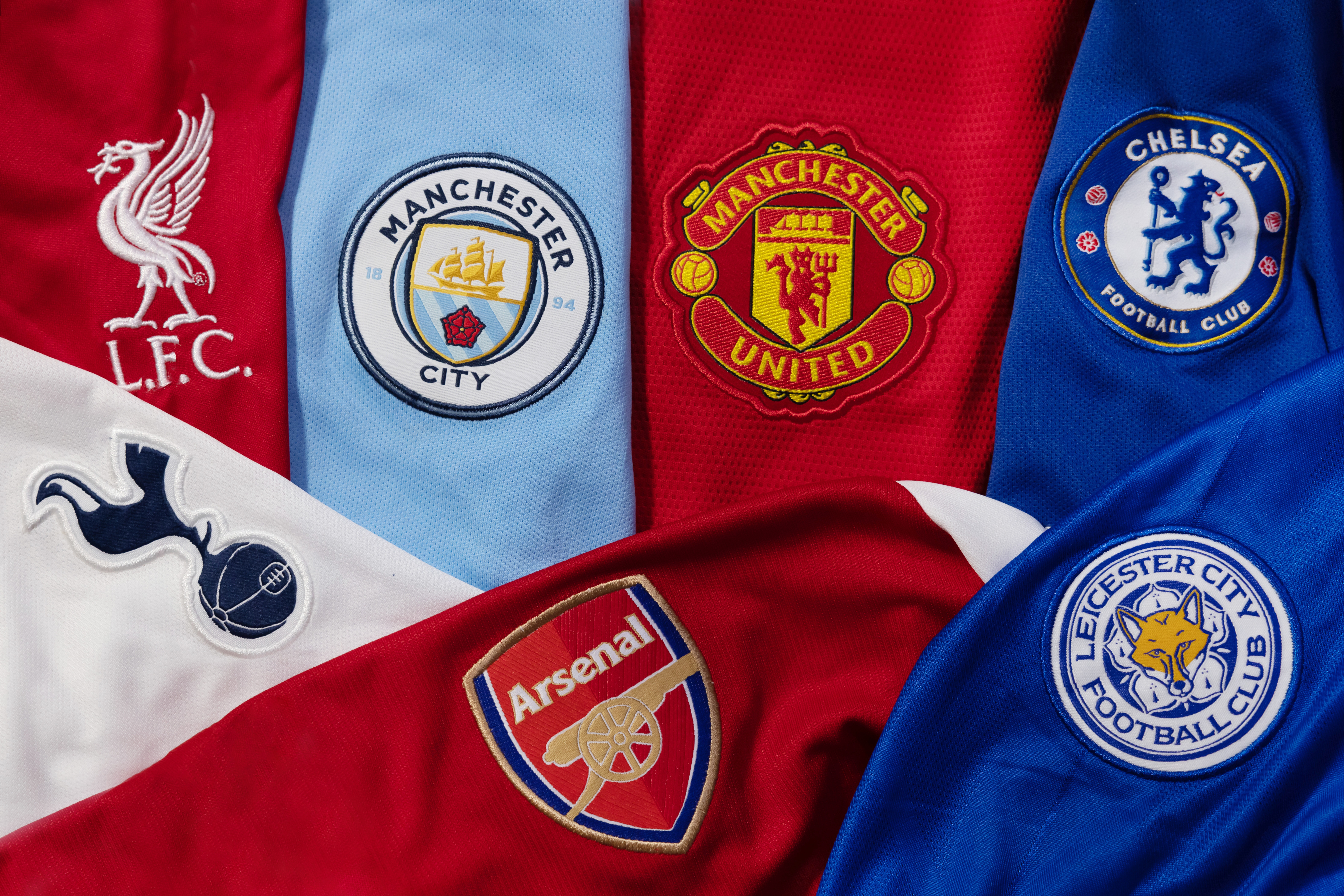 Premier League shirts with logos for L.F.C, Manchester United, Chelsea, Arsenal, And Leiccester City. 