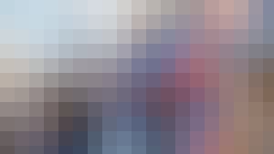 Someone sports betting and watching the game from the stands.