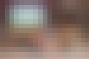 Someone sports betting on a football game and watching the game.