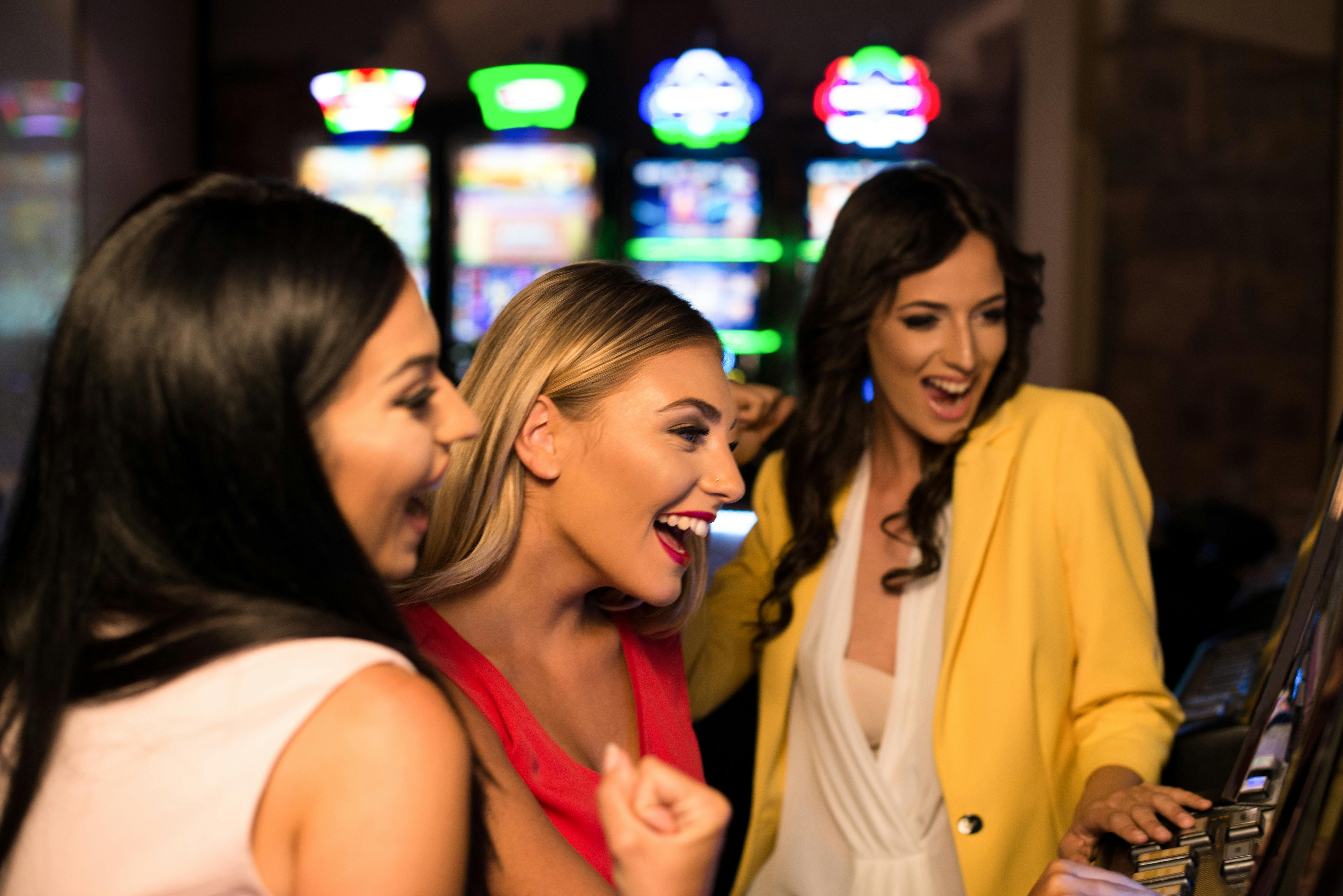 Three women enjoying a slot game. 