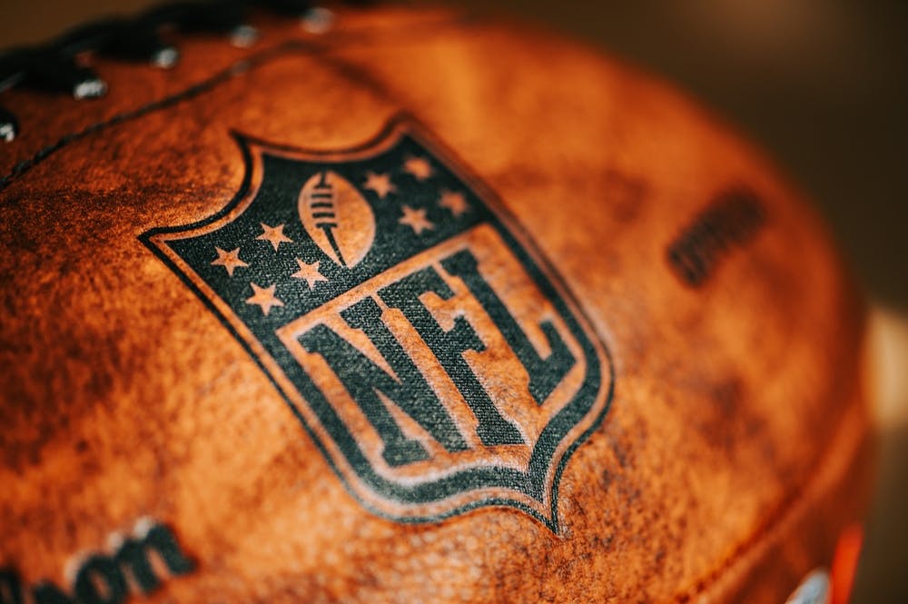 Close up of the NFL logo on a football. 