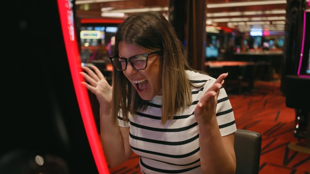 Casino slots winner celebrating. 